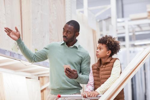 Father showing his son different materials