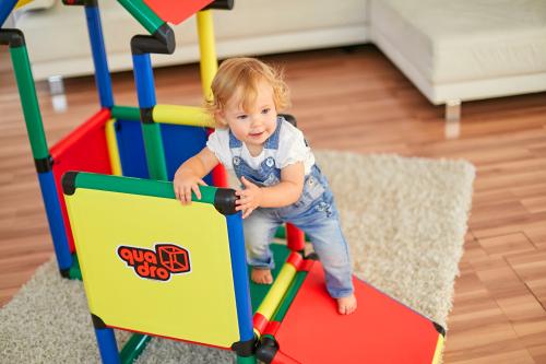 Child climbing up a QUADRO step